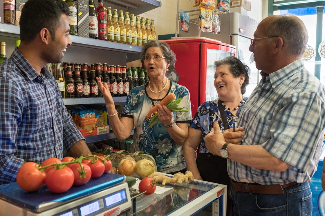 In Portugal, K’Cidade, AKF’s urban community support programme, brings together people from different backgrounds and ages by involving them in community improvement and development activities. Shakib, a Nepalese immigrant, operates a small grocery shop in Vale de Alcantara, a neighbourhood where many seniors live (photo). They benefit from his services and teach him Portuguese. AKDN / Lucas Cuervo Moura