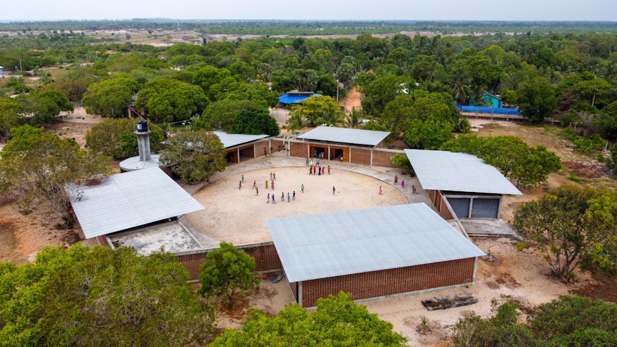 Aerial view of the Lanka Learning Centre showing its pentangular plan and integration into the landscape. The architects kept all the existing trees, which now provide shade to the complex. | Aga Khan Trust for Culture / Nipun Prabhakar (photographer)
