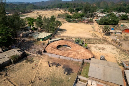 Aerial view of the Safe Space for Women and Girls in Camp 25. The activity areas and rooms are organised around an open courtyard, connecting them into one larger space. | Aga Khan Trust for Culture / Asif Salman (photographer)