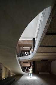 View of the white concrete grand staircase. | Aga Khan Trust for Culture / Deed Studio (photographer)
