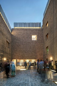 The entrance is a socially charged, inviting, brick-clad and brick-paved courtyard. | Aga Khan Trust for Culture / Deed Studio (photographer)