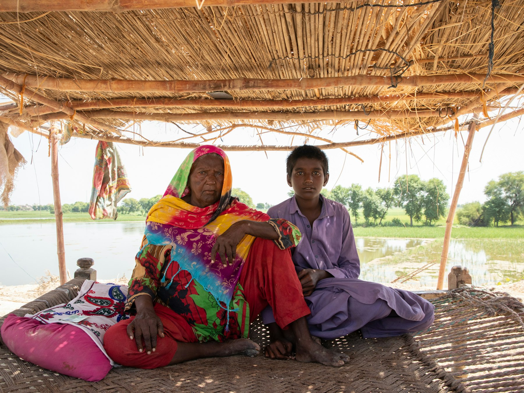 A woman in Sindh with her grandson – the 2022 floods destroyed their home.